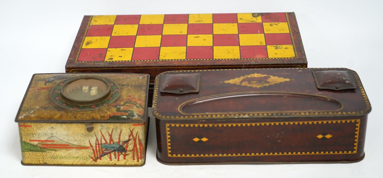 An early 20th century Carrs novelty 'dice game' biscuit tin, a Don Confectionery 'chessboard' tin and a Wright & Son Ltd inkstand tin, largest 33cm wide. Condition - fair